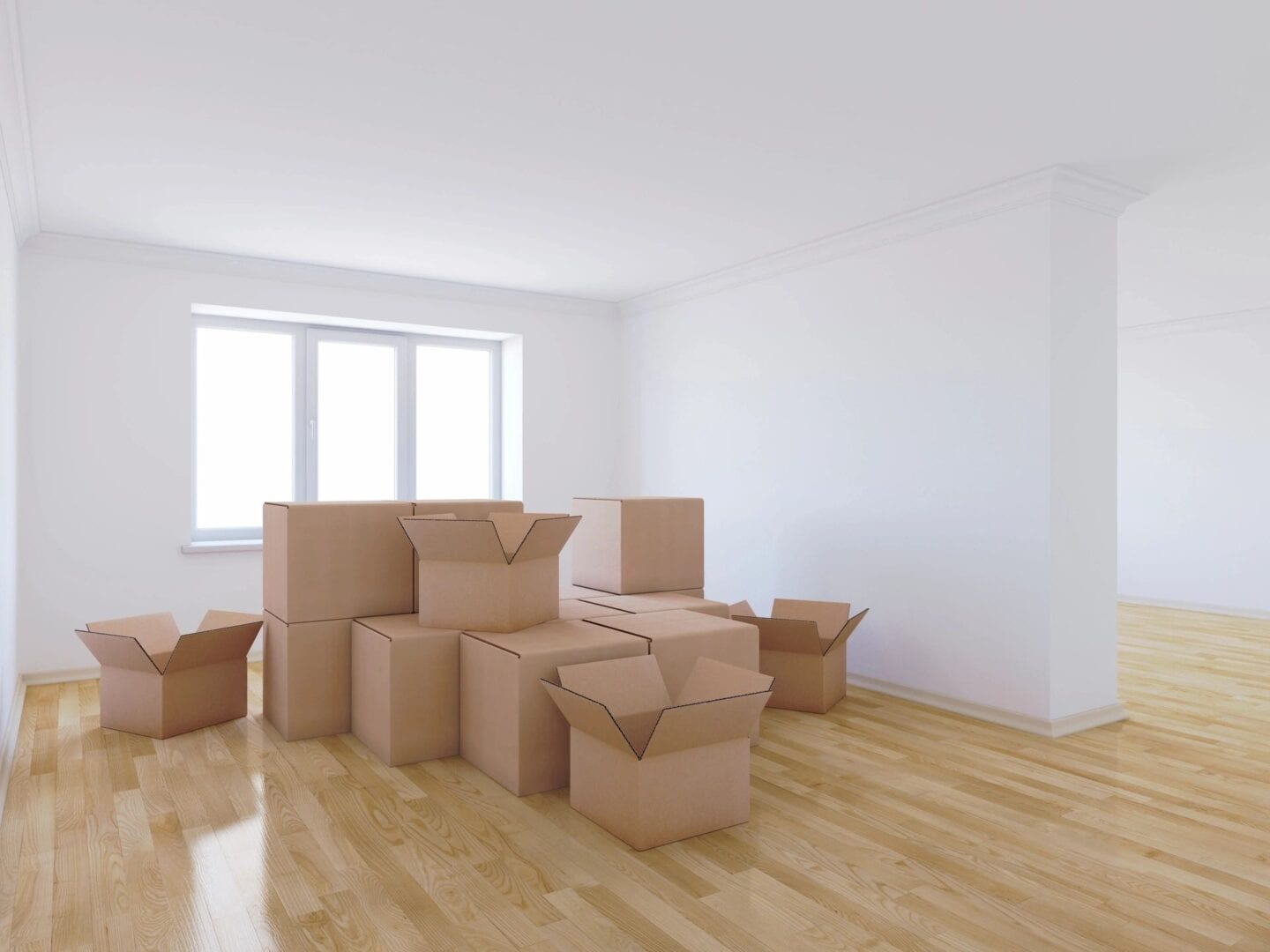 A room with boxes and furniture in it.