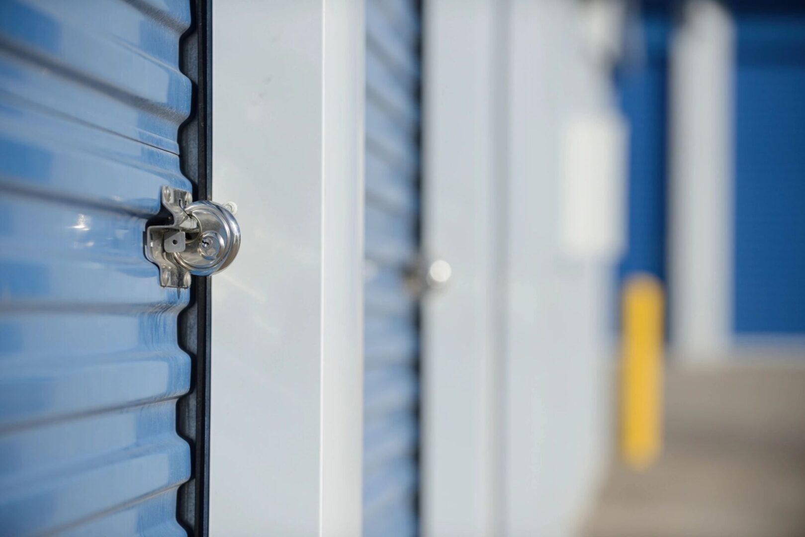 A close up of the door handle on a storage unit.